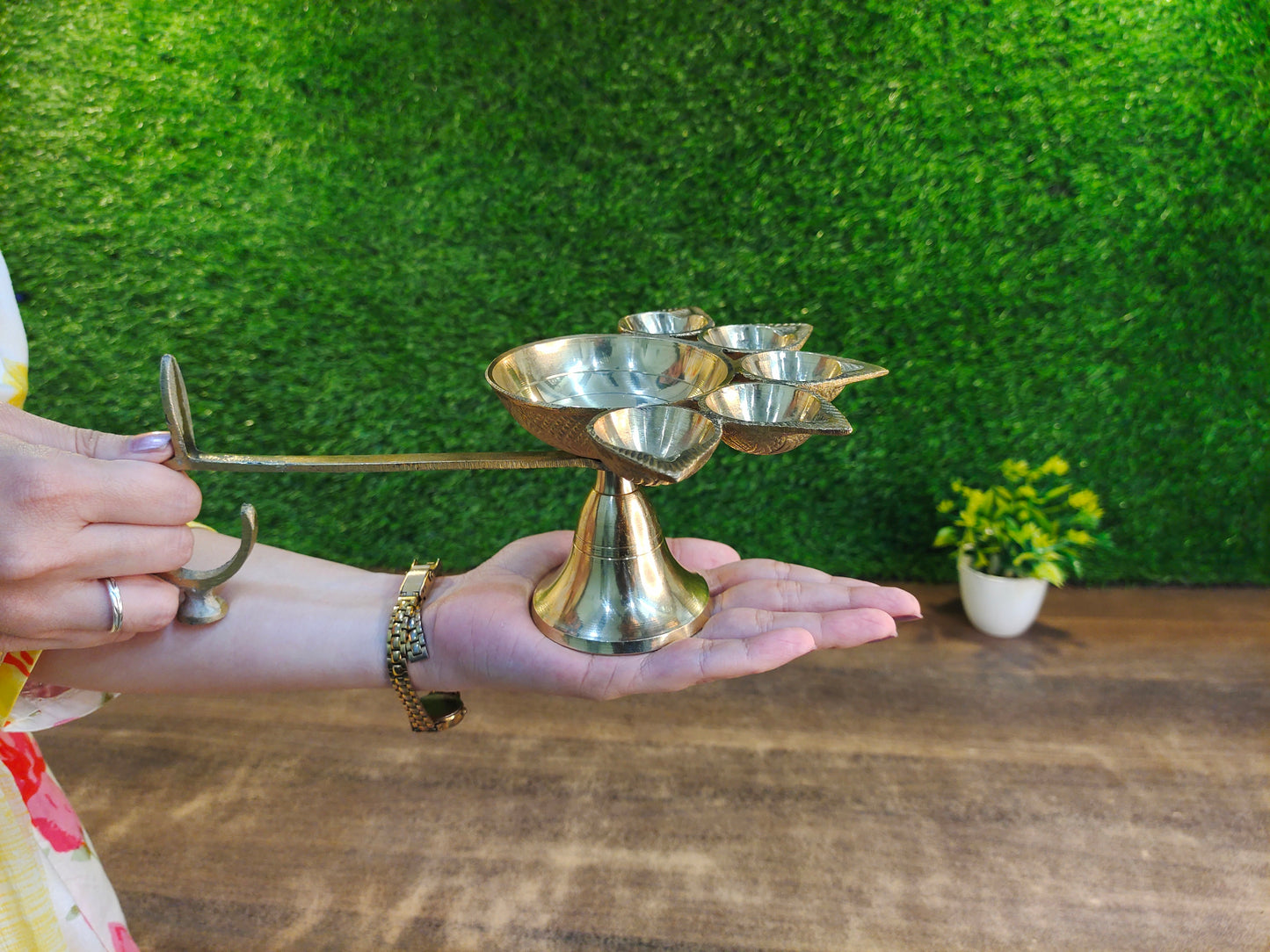 in hand view of Pure Brass Panchmukhi Diya