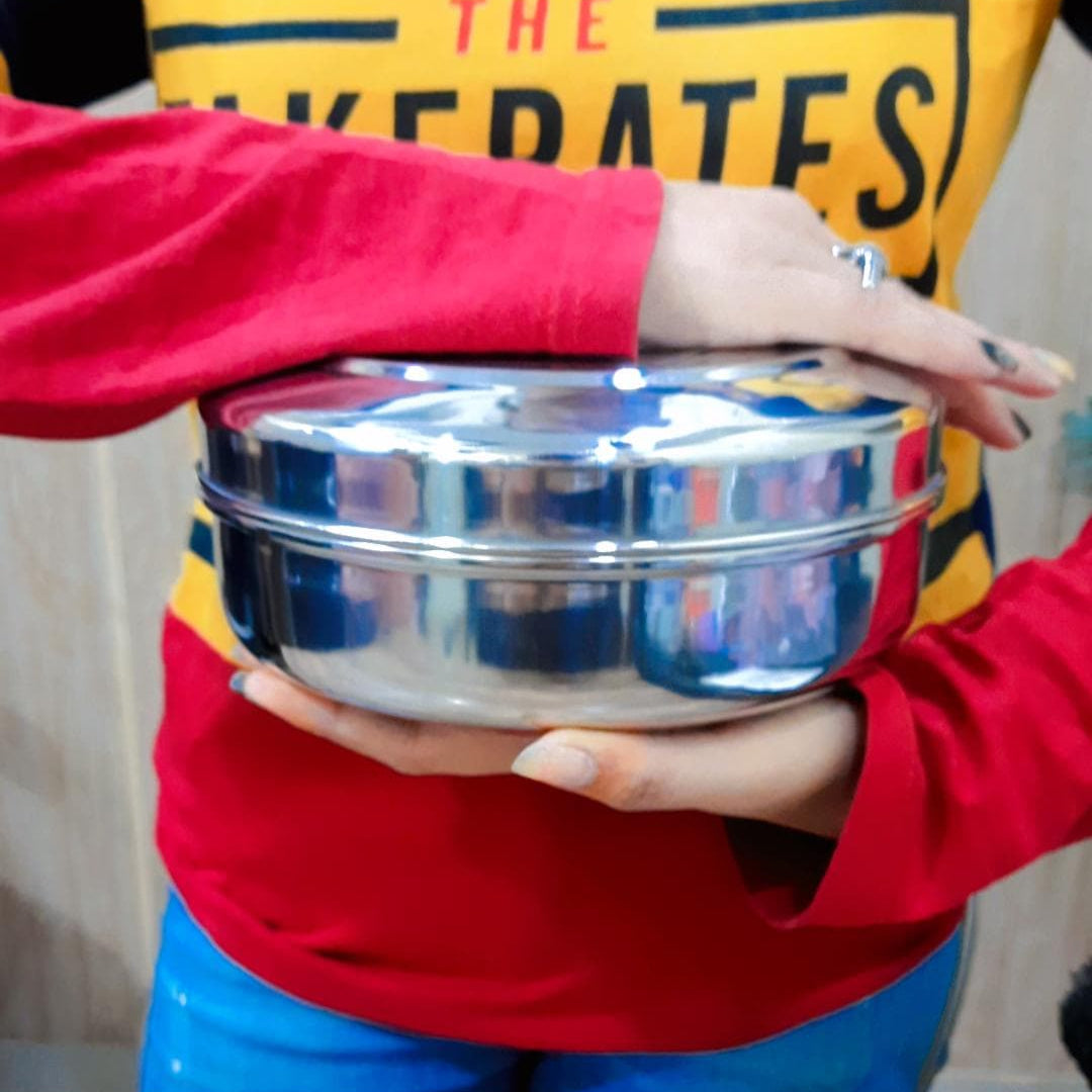Showing in hand Stainless Steel Chapati Box