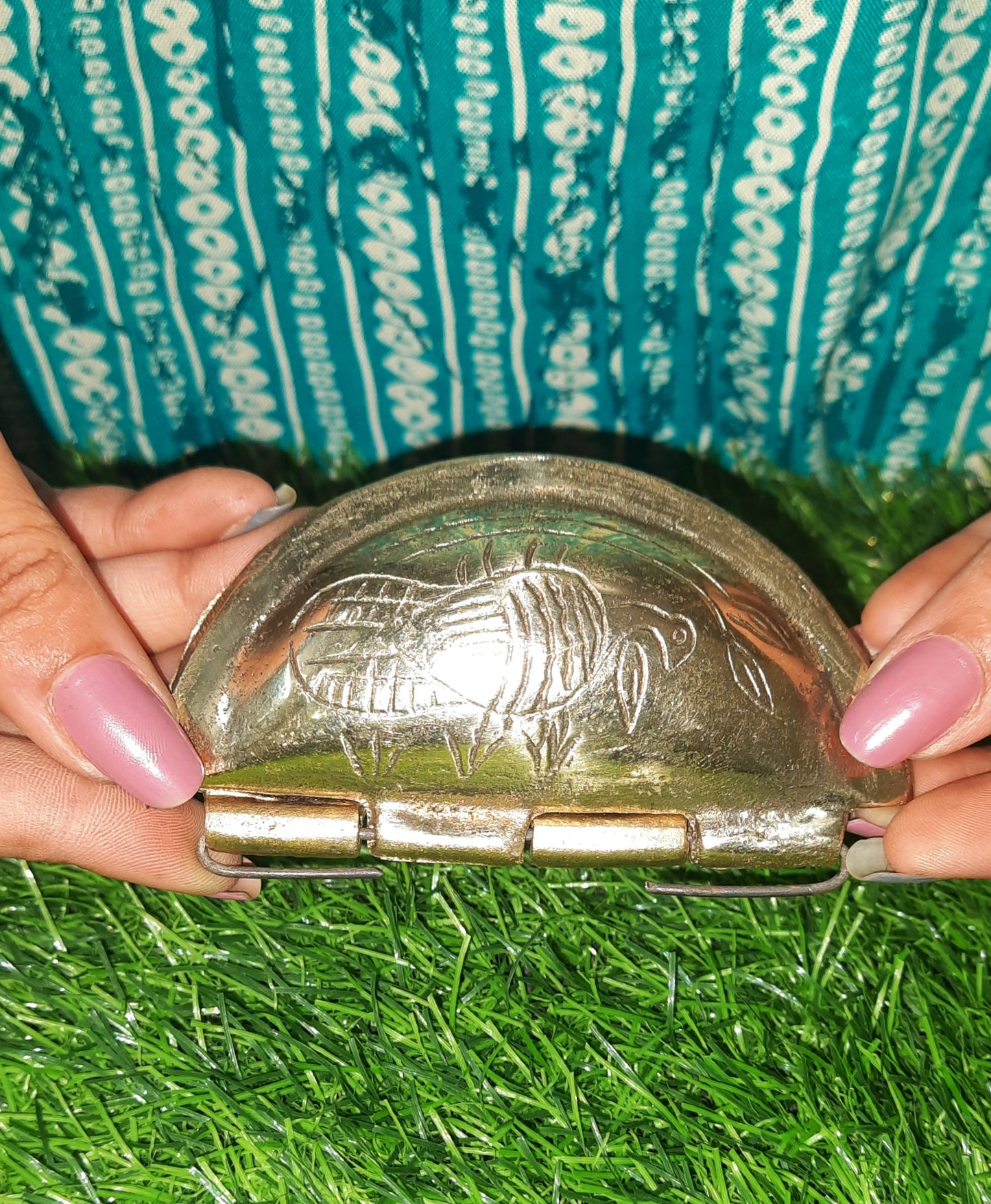 showing brass gujiya maker