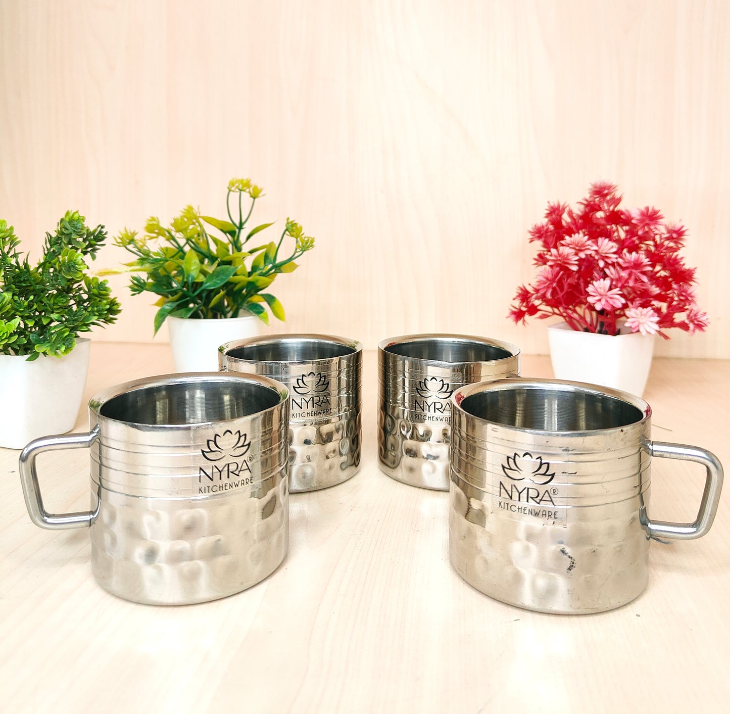 four double wall stainless steel cups on the table