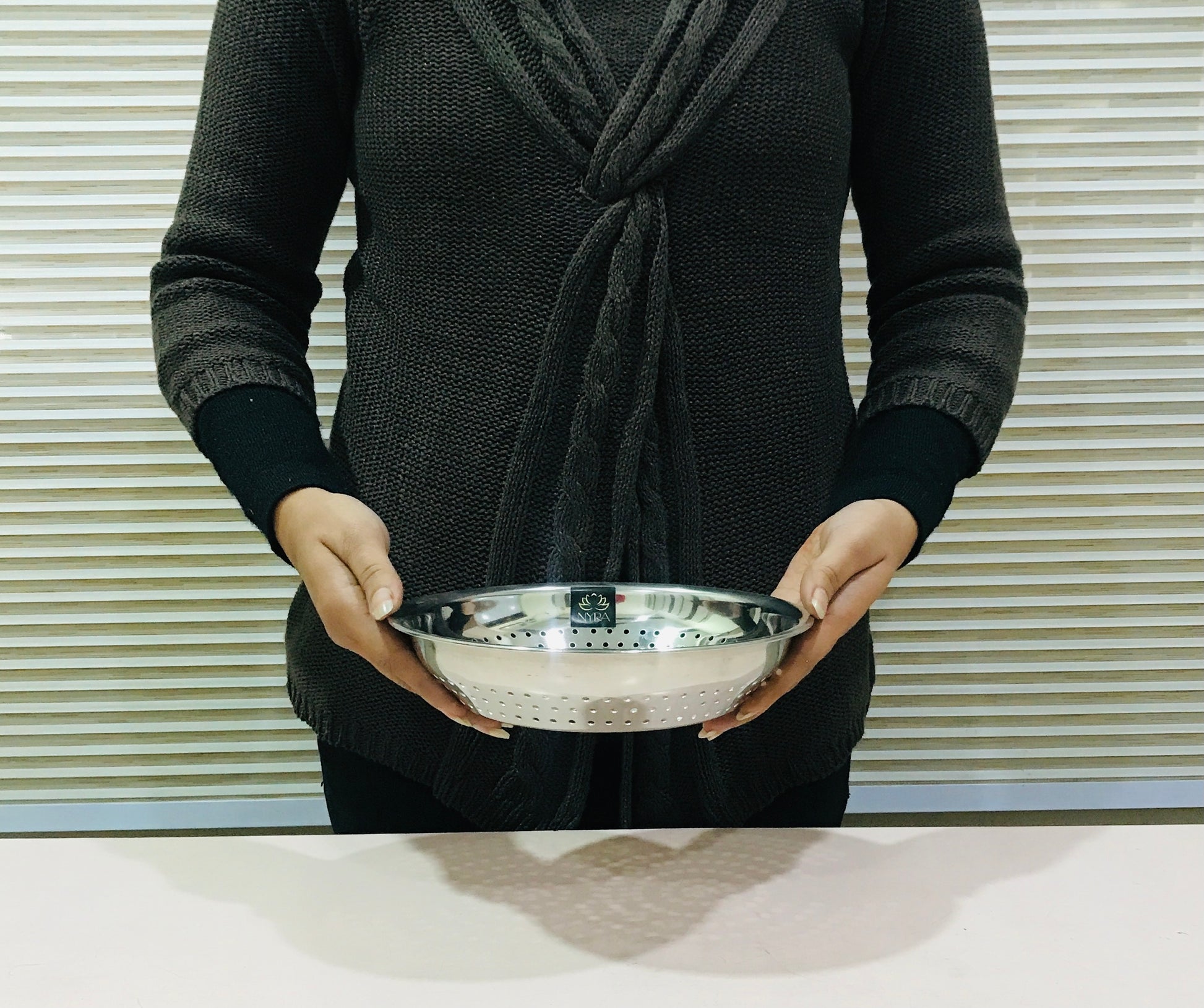 showing inhand Stainless Steel Strainer & Colanders