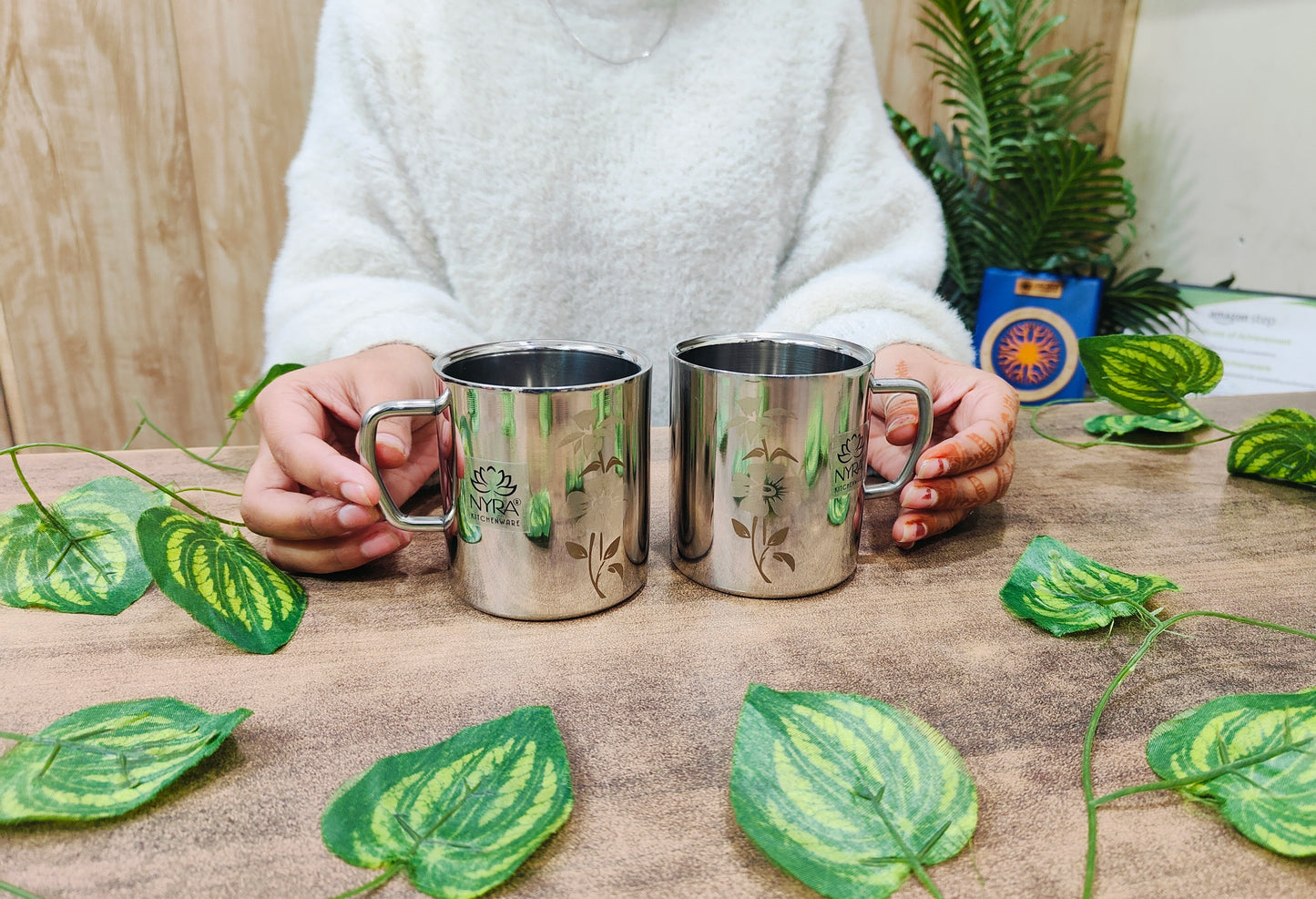 showing in hand Stainless Steel Double-walled Mug Set