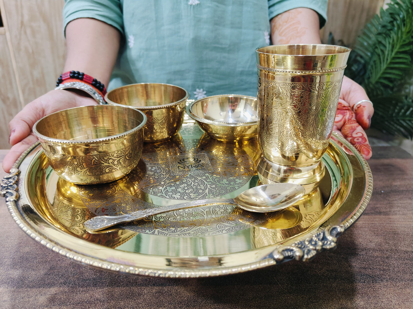 showing brass dinner thali set