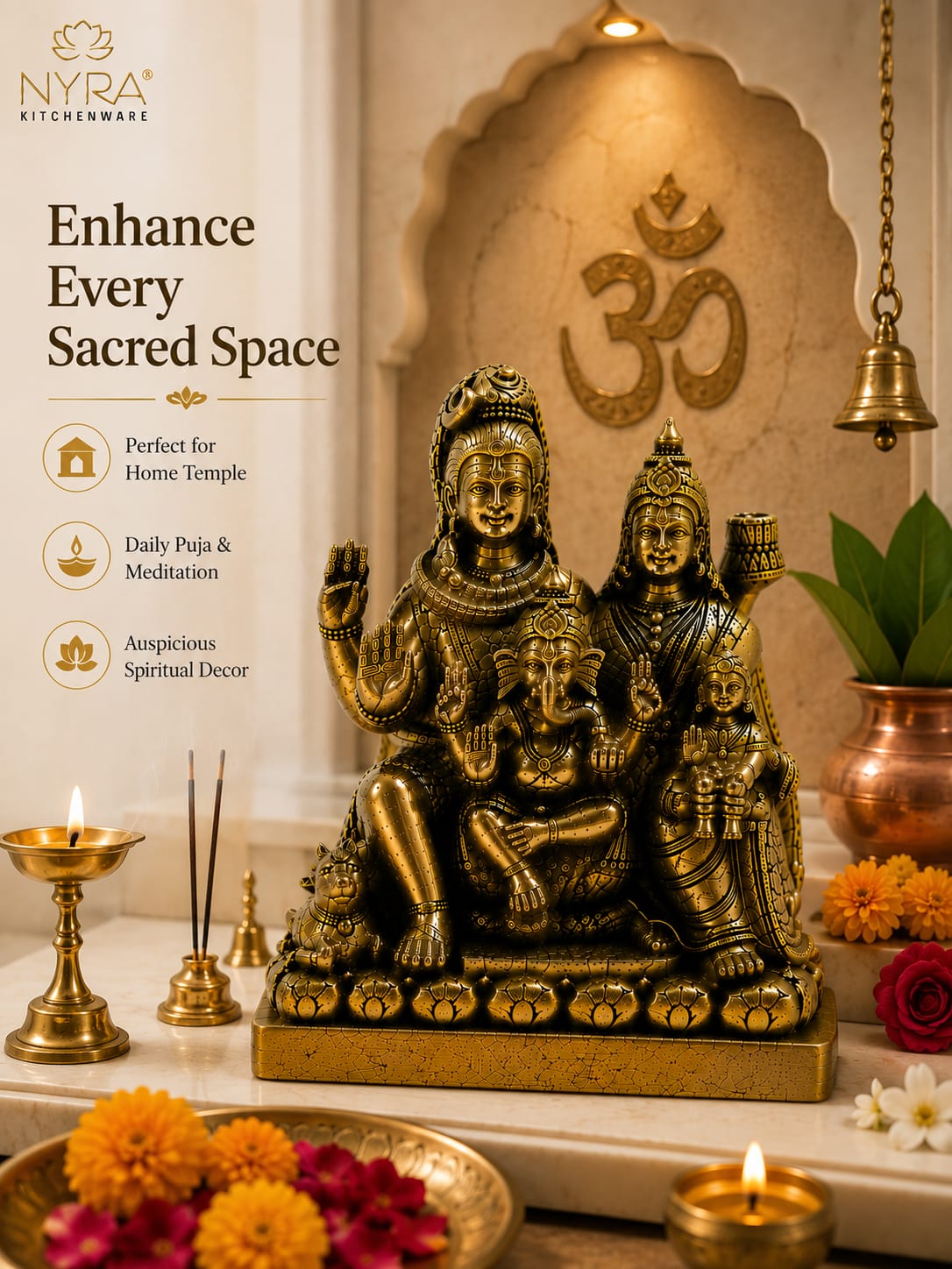 A brass-toned Hindu deity statue with multiple seated figures, displayed on a marble surface with lit oil lamps, incense, flowers, and a decorative wall arch behind it. Text on the left reads 'NYRA Kitchenware' and 'Enhance Every Sacred Space.