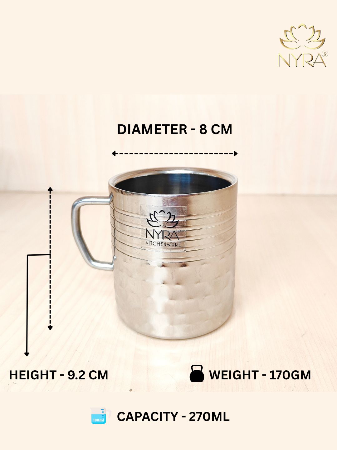 Silver mug with Nyra Kitchenware branding, showing measurements and weight on a light background.