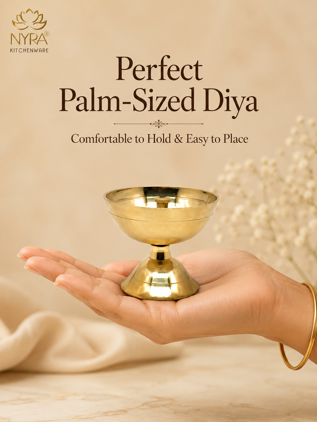 A brass diya holder being held in a person's hand, with text reading 'Perfect Palm-Sized Diya' and 'Comfortable to Hold & Easy to Place' on a warm beige background. The NYRA KITCHENWARE logo appears in the top left.