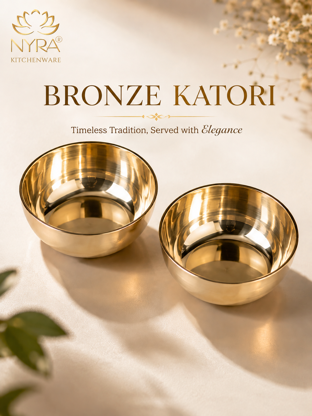 Two polished bronze katori serving bowls on a warm cream background with decorative dried flowers and green leaves. The NYRA Kitchenware logo and the text 'BRONZE KATORI' are displayed at the top.