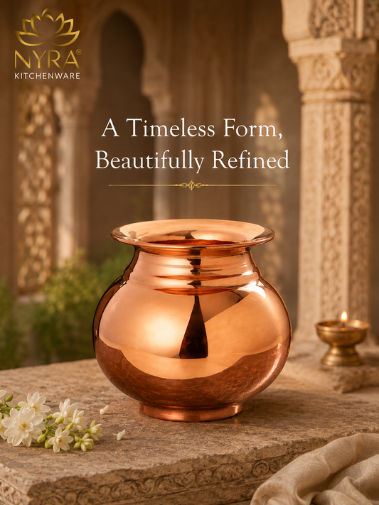 A polished copper-colored metal pot with a rounded body and flared rim, displayed on a stone surface in a warm architectural setting. White text reads 'A Timeless Form, Beautifully Refined,' and the NYRA Kitchenware logo appears in the top left.