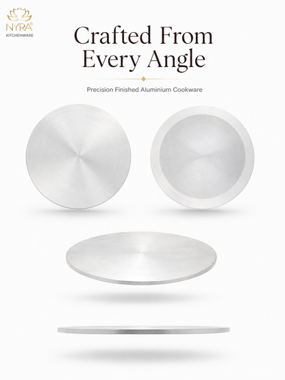A set of minimalist silver aluminum cookware pieces shown from multiple angles on a clean white background, with the text 'Crafted From Every Angle' and 'Precision Finished Aluminium Cookware' above them. The NYRA Kitchenware logo appears in the top left corner.