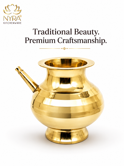 A polished brass traditional Indian kitchen vessel, likely a coppera or kalash, shown on a white background with the NYRA Kitchenware logo and the text 'Traditional Beauty. Premium Craftsmanship.