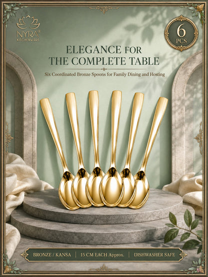 Six coordinated bronze spoons displayed upright on a stone pedestal with draped fabric and an elegant interior backdrop. Text reads 'ELEGANCE FOR THE COMPLETE TABLE,' 'Six Coordinated Bronze Spoons for Family Dining and Hosting,' '6 PCS,' and 'BRONZE / KANSA | 15 CM EACH Approx.