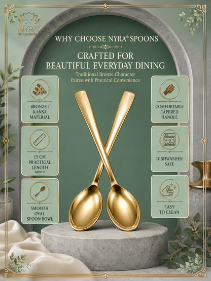 A pair of crossed gold spoons displayed on a stone pedestal in a styled promotional graphic. The design includes text reading 'WHY CHOOSE NVY SPOONES' and feature callouts about bronze/kansa material, comfortable tapered handle, 15 cm practical length, dishwasher safe, and easy to clean.