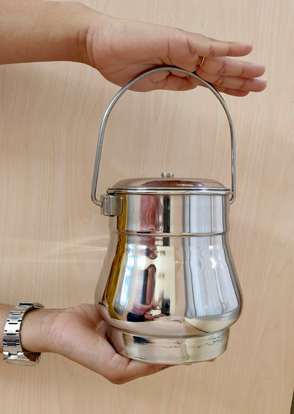 showing in hand Stainless Steel Milk Pot/Container with lid