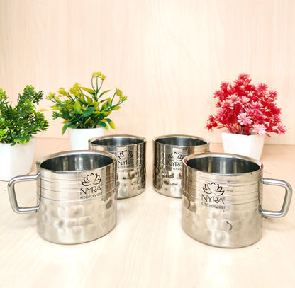 four double wall stainless steel cups on the table