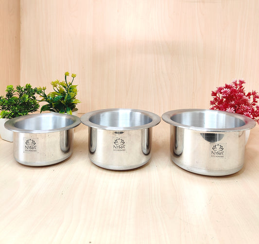 Three stainless steel bowls with a brand logo on a light wooden surface.