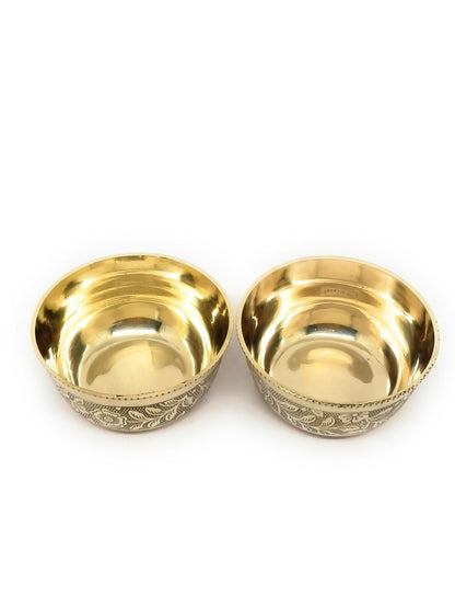 Two small metallic bowls with a polished gold interior and a silver-toned engraved exterior, shown side by side on a plain white background.