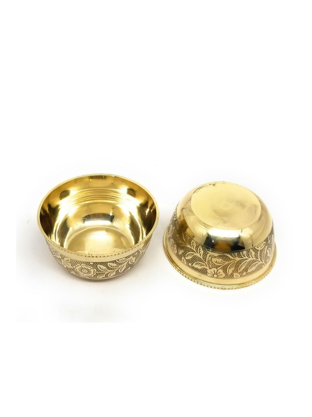 Two small metallic bowls with ornate engraved floral patterns, one shown upright and the other upside down, on a plain white background.
