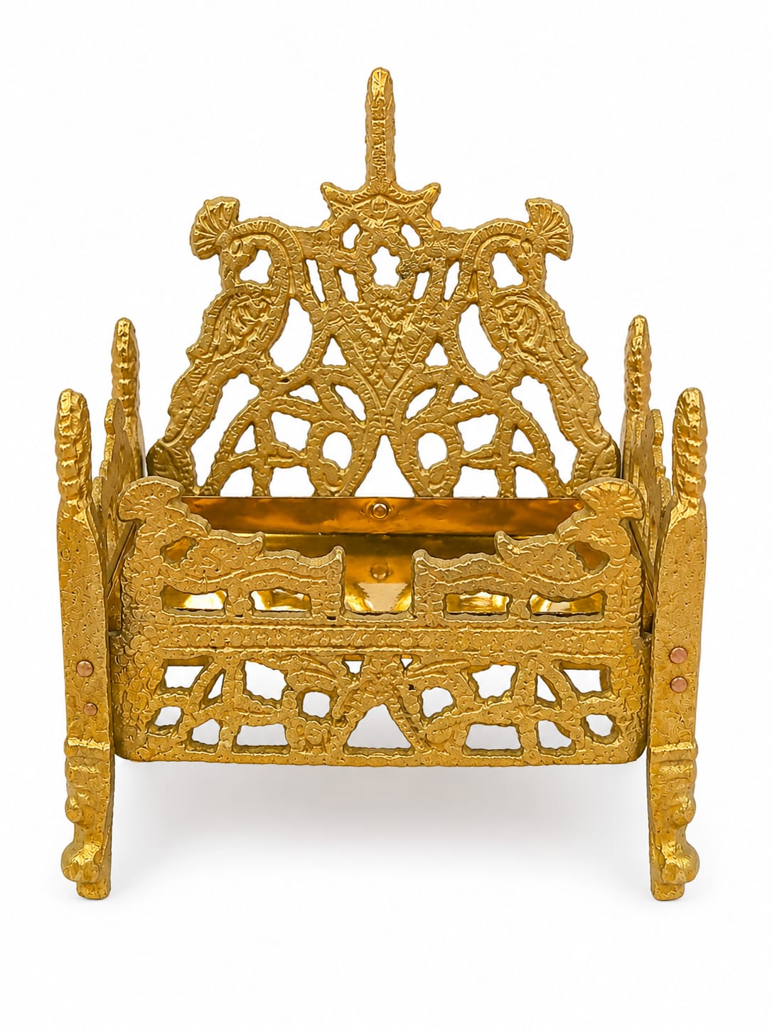 Decorative gold metal holder with intricate designs on a white background