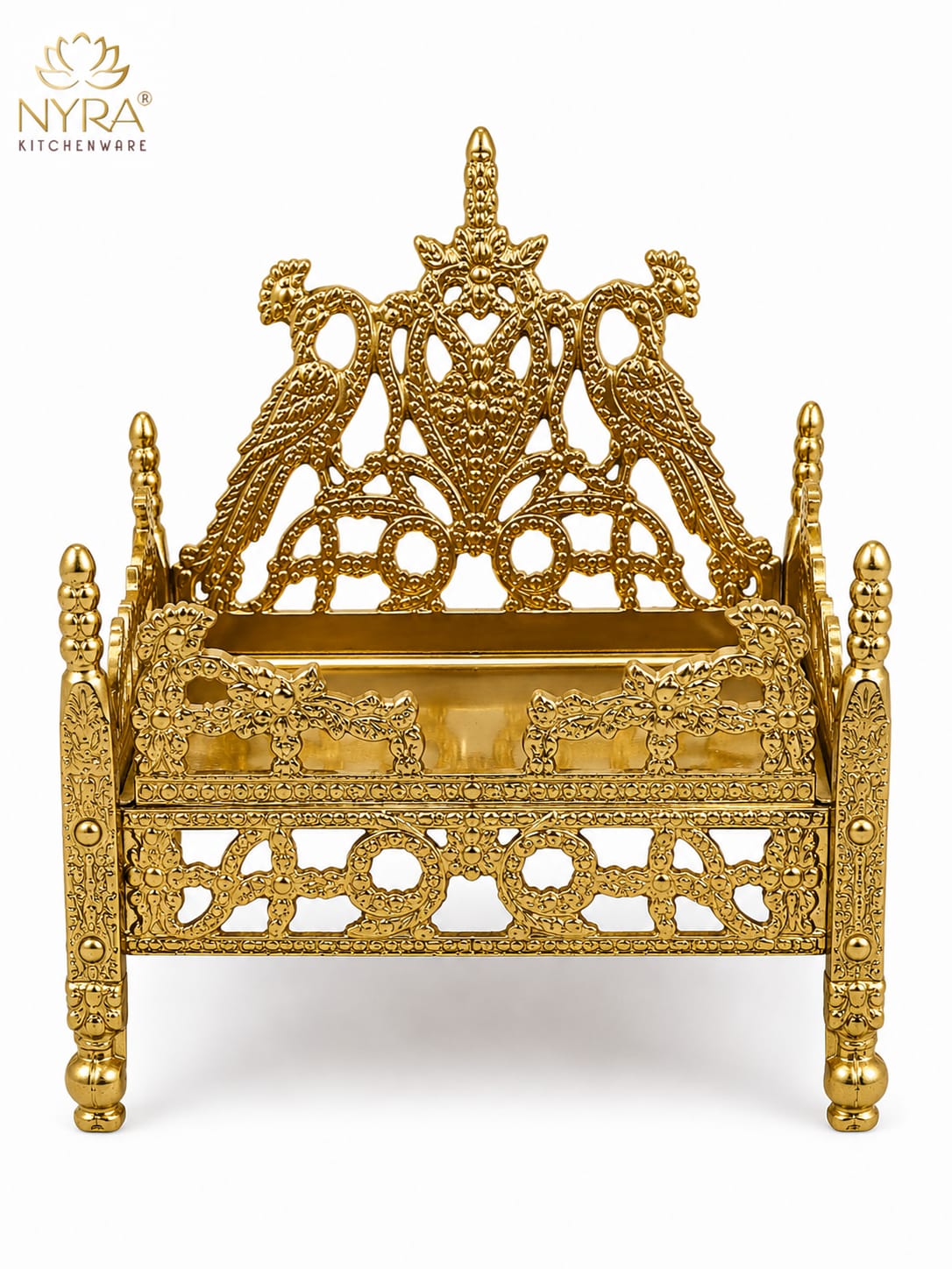 An ornate gold-plated brass miniature throne or palanquin with intricate filigree cutouts, decorative pillars, and a detailed crest on the backrest, shown on a white background with the NYRA Kitchenware logo in the top left corner.