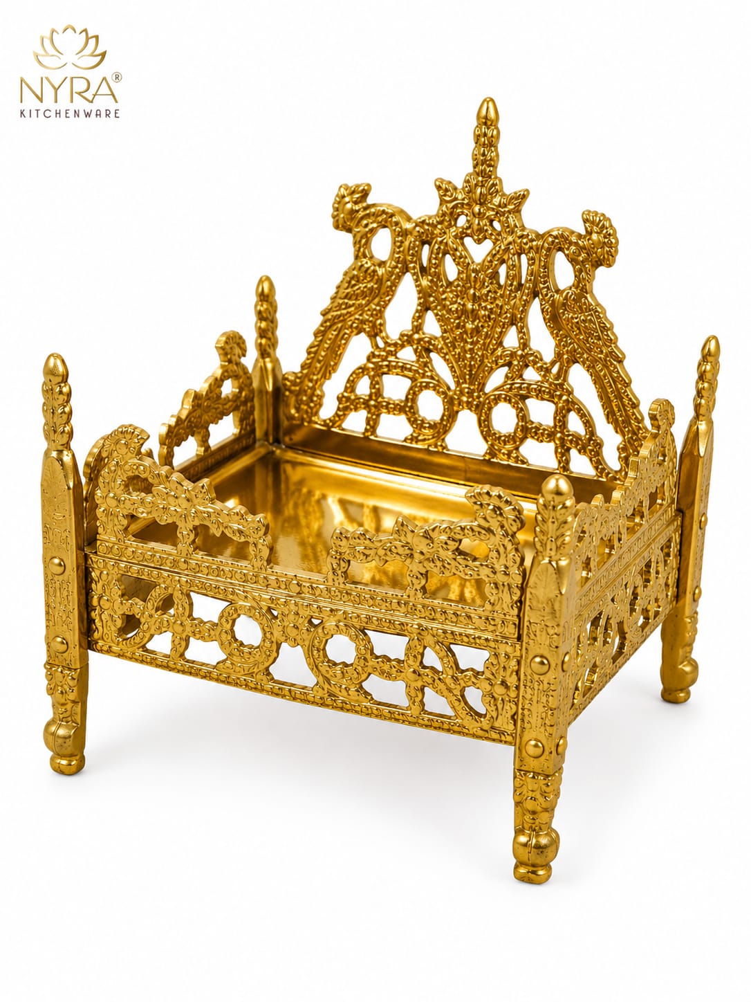 An ornate gold-plated brass miniature bed with intricate filigree cutouts and a reflective tray, shown on a white background with the NYRA Kitchenware logo in the top left corner.