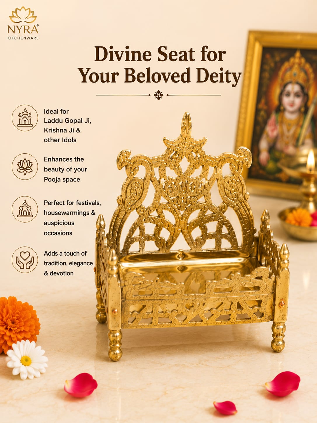 A golden brass idol of a throne-like deity seat with intricate filigree and bird carvings, displayed on a cream surface with decorative flowers, rose petals, a framed deity portrait, and a lit oil lamp in the background. The image includes marketing text and the NYRA kitchenware logo.