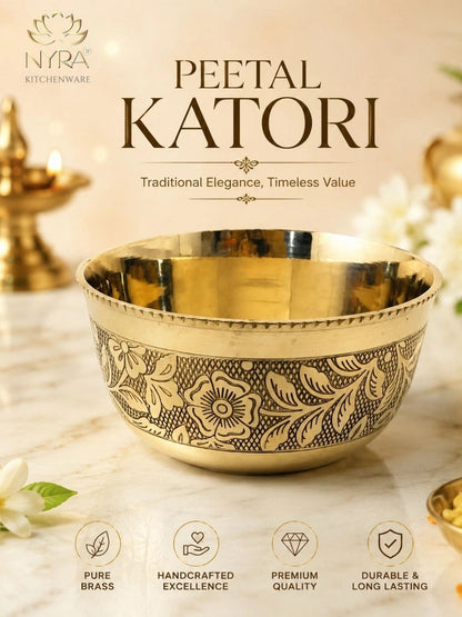 A polished brass Peetal Katori bowl with intricate floral engravings, displayed on a marble surface with warm decorative background elements and text overlays from NYRA Kitchenware.
